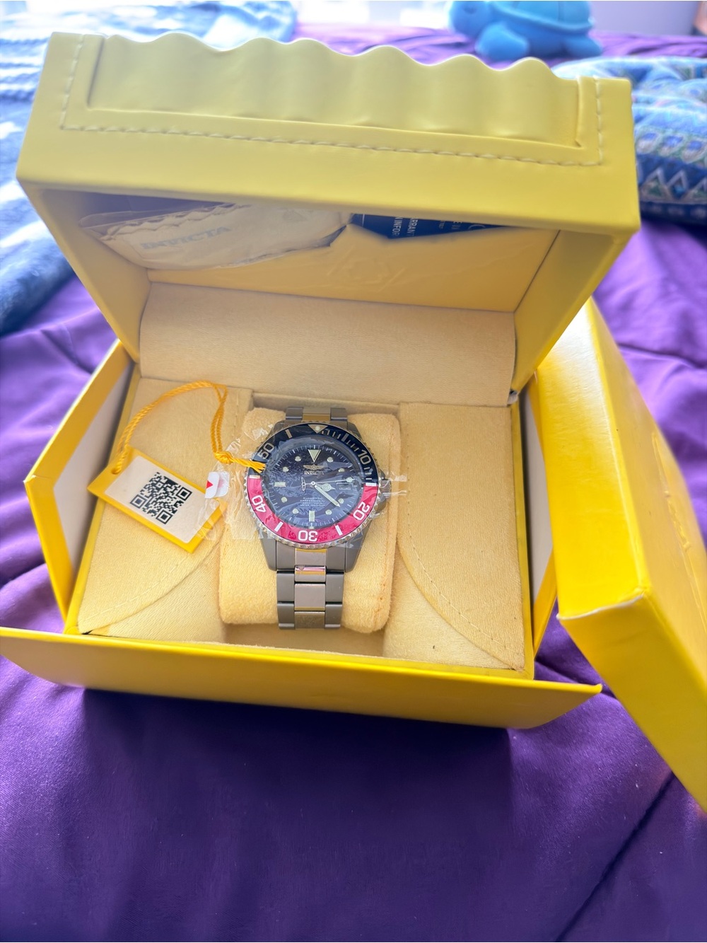 Men's Titanium Invicta Diver Watch with Blue and Red Bezel